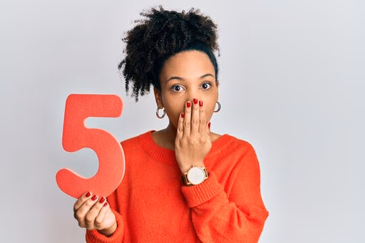 Lady recruiter looking curious with holding number 5 in hand