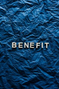 The word 'Benefit' displayed on crumpled blue paper, ideal for concepts.